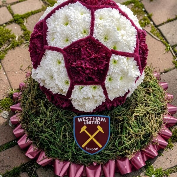 Football Tribute funeral flower arrangement with personalised football badge
